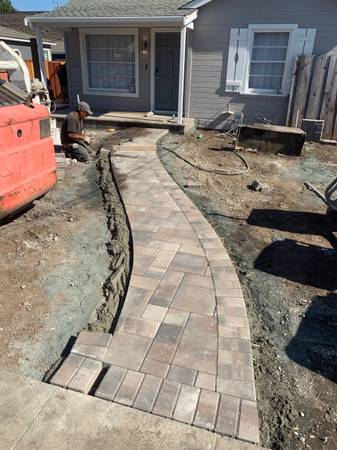 This image is a paver walkway project done in Brooklyn NYC. Our customer wanted a pavers walkway that was a mix of brown. This image was taken in Summer 2021.
